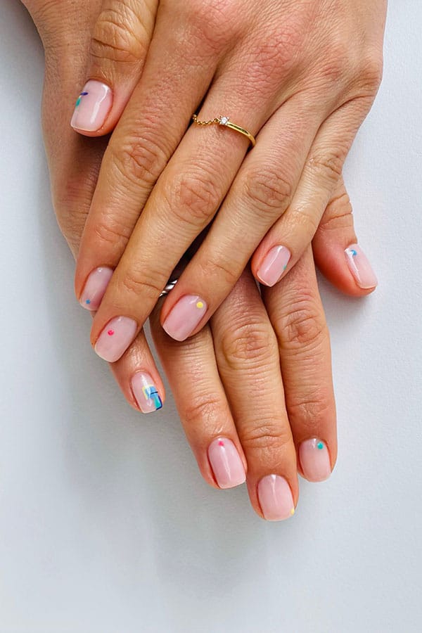 Hands showing manicured nails featuring nail art