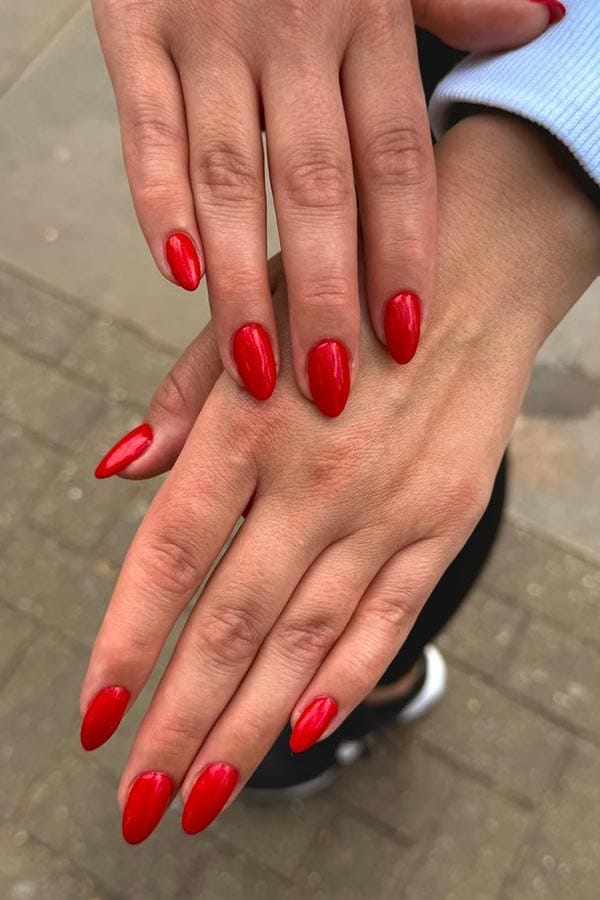 Manicured nails painted red