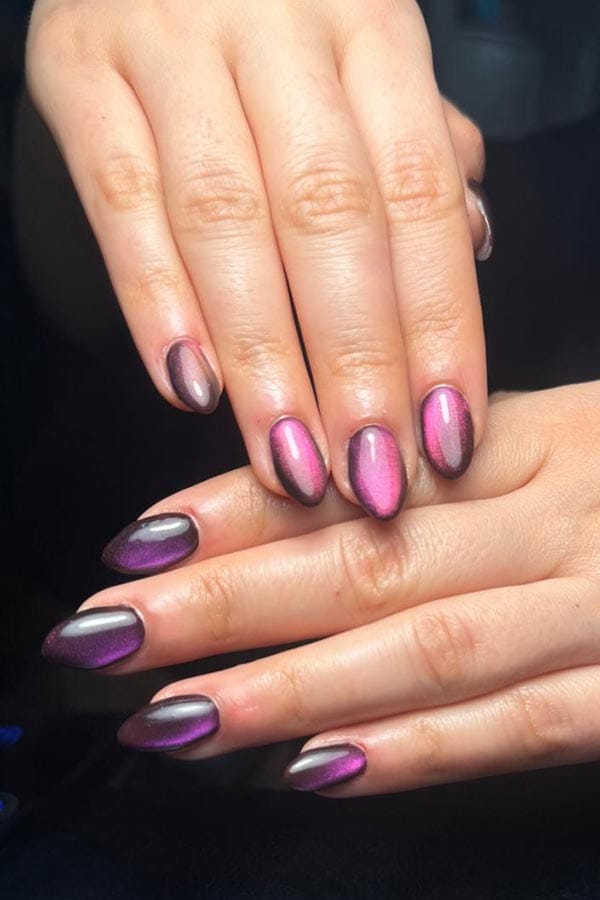 Hands showing manicure ombre pink and purple